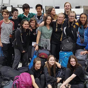 group of students with their backpacks ready for their big trip
