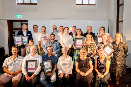 A group picture of award winners and presenters from the Australian Access Awards 2019 on a stage.