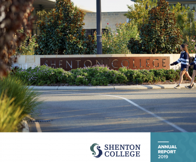 Two female students walking past the Shenton College entrance sign